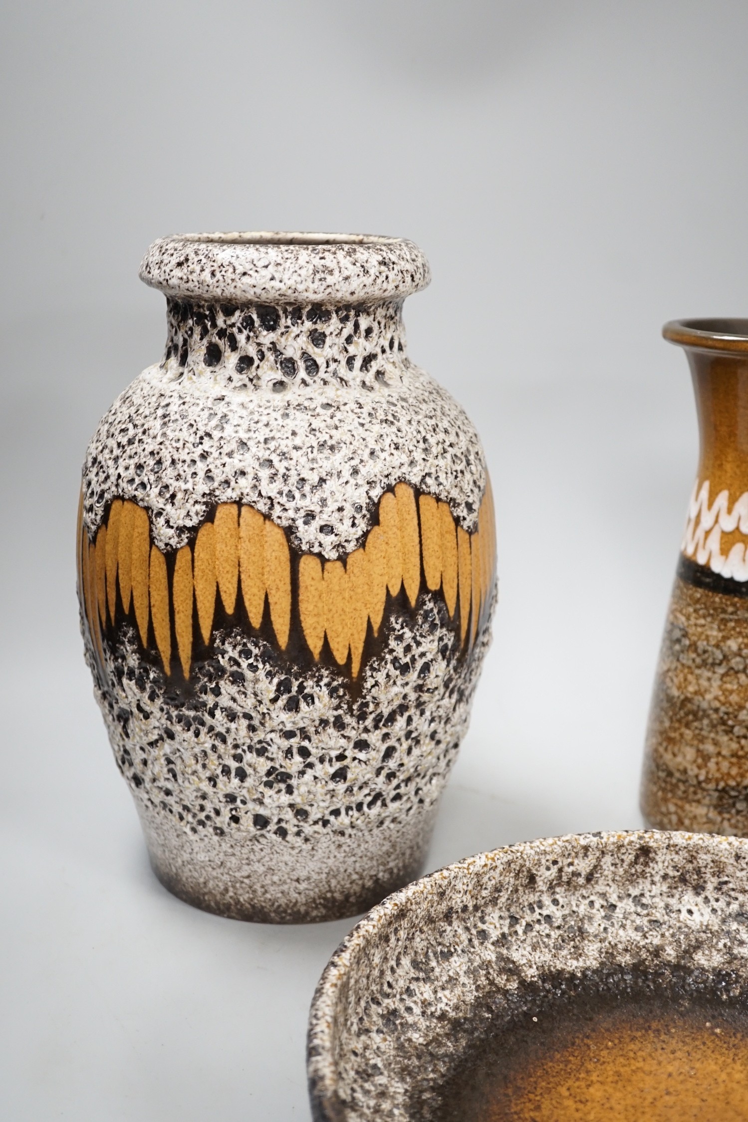 Three West German pottery vases, two lava glaze and a geometric vase